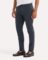 Side view of model wearing India Ink Ultimate Chinos, Skinny Fit.