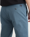 View of model wearing Indian Teal Men's Slim Fit Smart 360 Flex Alpha Chino Pants.