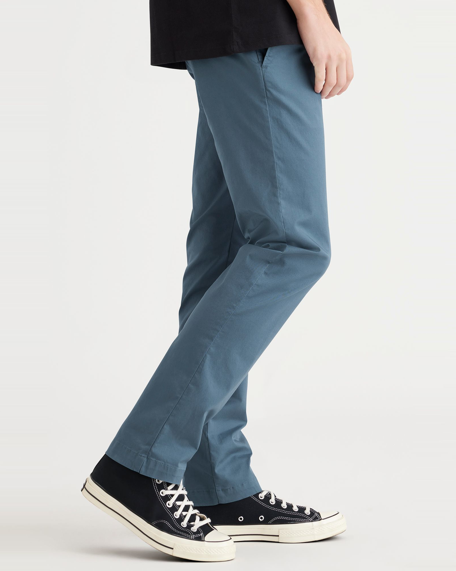 Side view of model wearing Indian Teal Men's Slim Fit Smart 360 Flex Alpha Chino Pants.