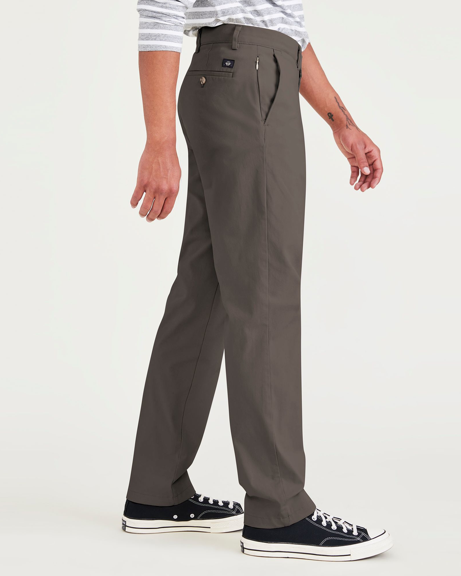 Side view of model wearing Khaki Green Men's Slim Fit Smart 360 Flex Alpha Chino Pants.