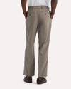 View of model wearing Lemon Pepper Eighty-Six Original Pleated Chinos, Loose Fit.
