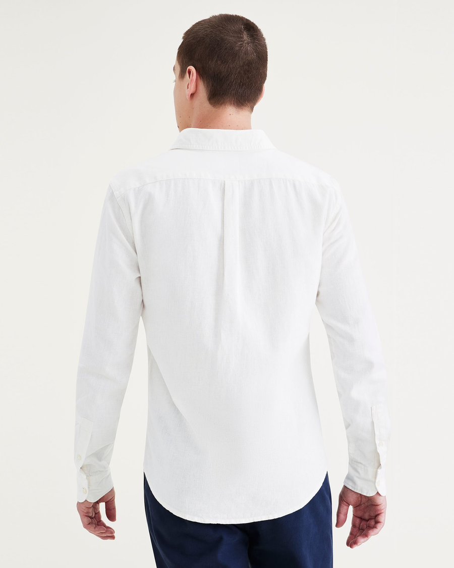 Back view of model wearing Light White Rigid Men's Slim Fit Icon Button Up Shirt.