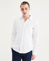 Front view of model wearing Light White Rigid Men's Slim Fit Icon Button Up Shirt.