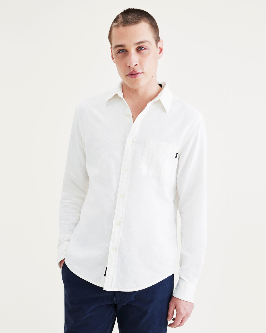 Front view of model wearing Light White Rigid Men's Slim Fit Icon Button Up Shirt.