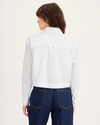 Back view of model wearing Lucent White Boxy Cropped Shirt, Relaxed Fit.
