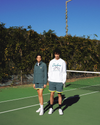 View of model wearing Lucent White Racquet Club Collared Sweatshirt, Relaxed Fit.