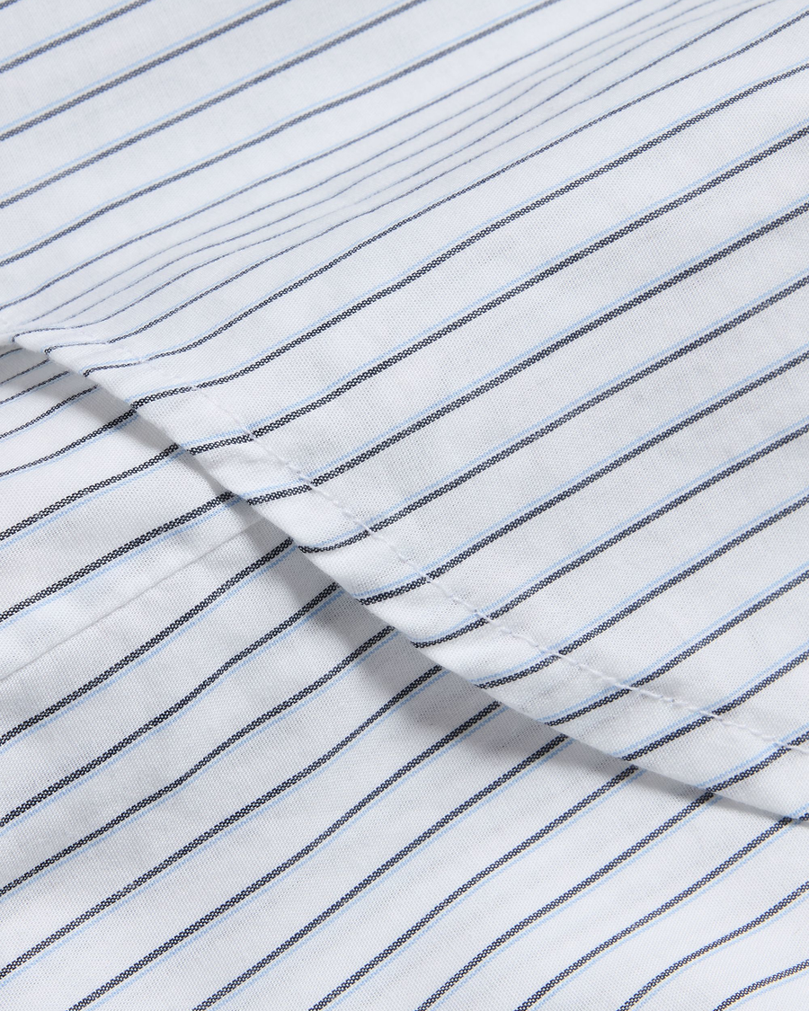 View of model wearing Lucent White Signature Shirt with Stain Defender®, Slim Fit.