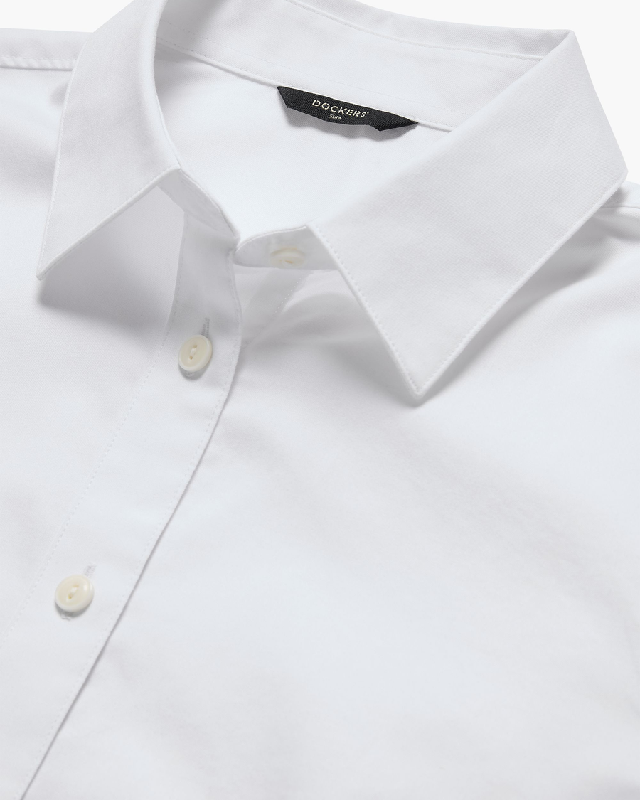 View of model wearing Lucent White Signature Shirt with Stain Defender®, Slim Fit.