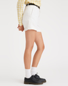 Side view of model wearing Lucent White Women's Original Chino Shorts.