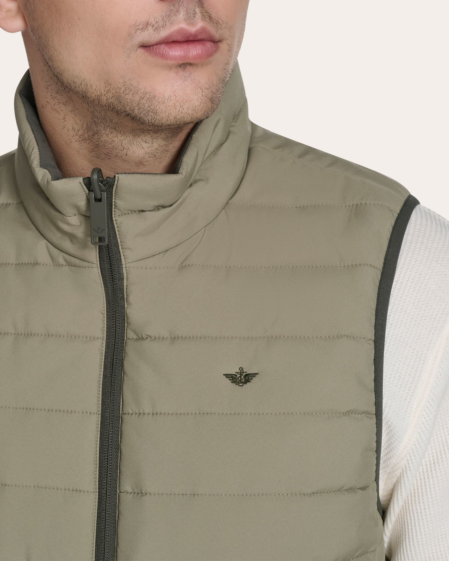 View of model wearing Mermaid Reversible Puffer Vest.