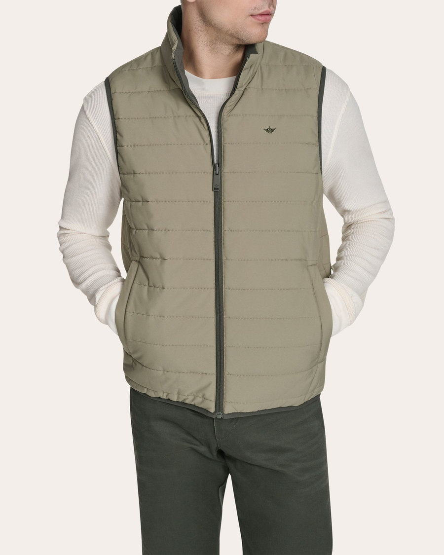 Back view of model wearing Mermaid Reversible Puffer Vest.