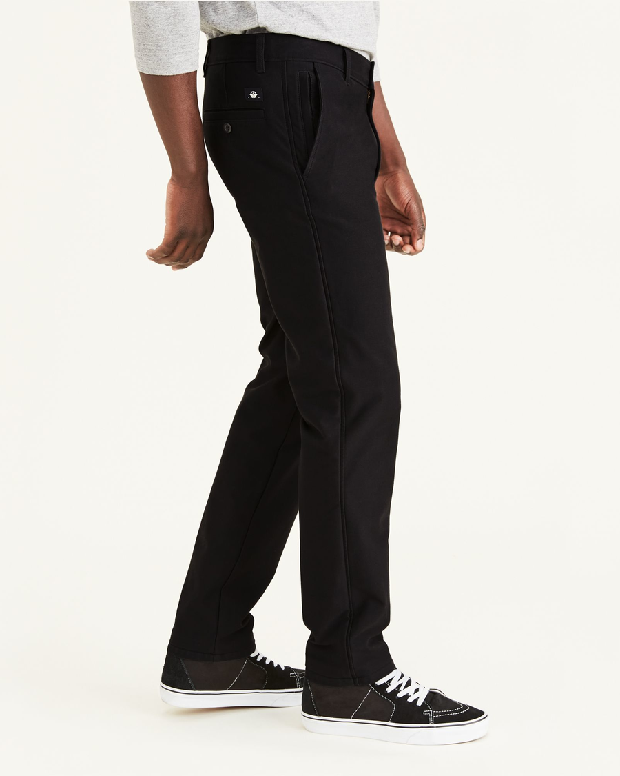 Side view of model wearing Mineral Black Men's Smart 360 Flex Comfort Knit Chino.