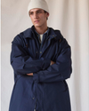 View of model wearing Navy Blazer Dockers® x Transnomadica Squall Coat.