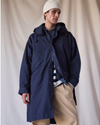 Front view of model wearing Navy Blazer Dockers® x Transnomadica Squall Coat.