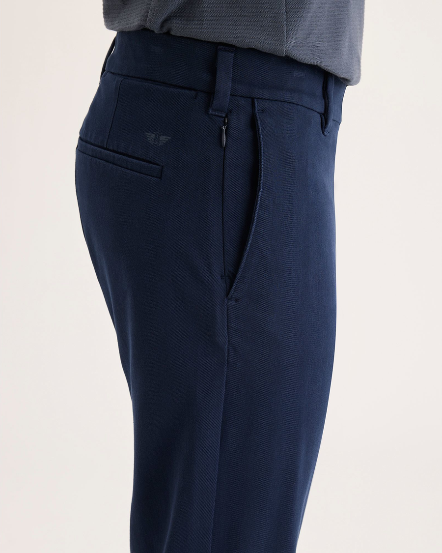 Side view of model wearing Navy Blazer Go Activeflex Chino, Slim Fit.