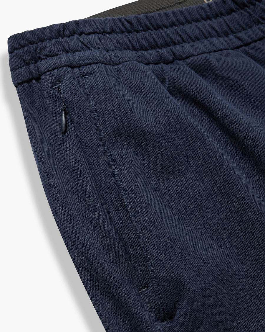 View of model wearing Navy Blazer Go Activeflex Pull-On Pant, Slim Fit.