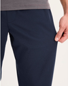 View of model wearing Navy Blazer Go Activeflex Pull-On Pant, Slim Fit.