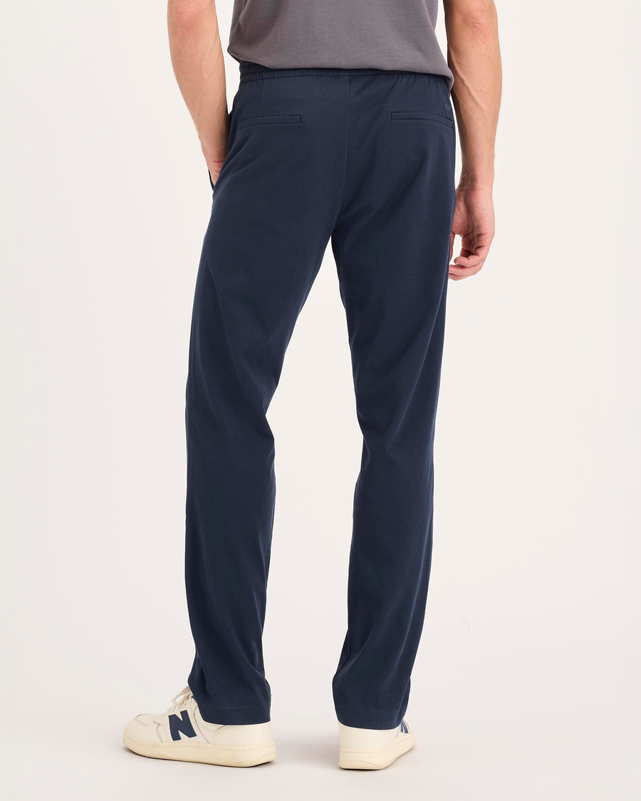Back view of model wearing Navy Blazer Go Activeflex Pull-On Pant, Slim Fit.