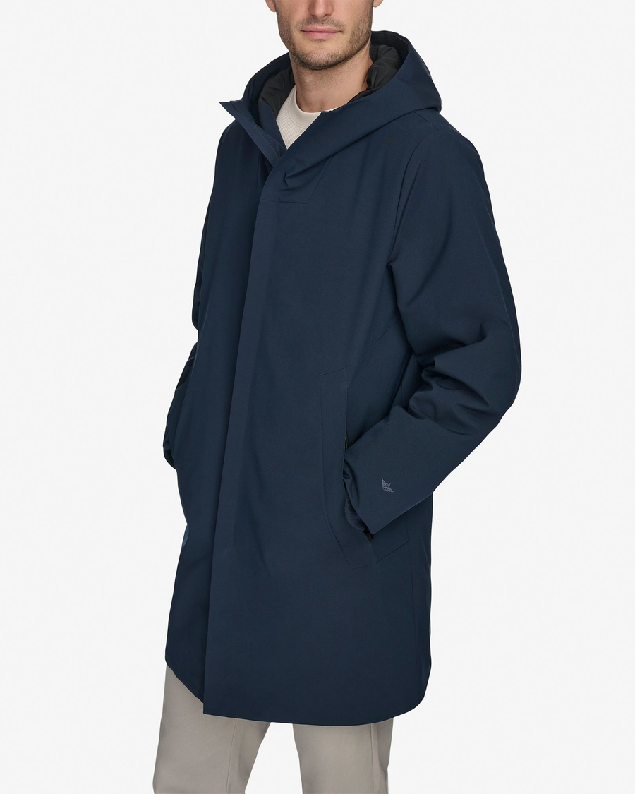 Front view of model wearing Navy Blazer Men's Performance Welded Modern Parka Jacket.