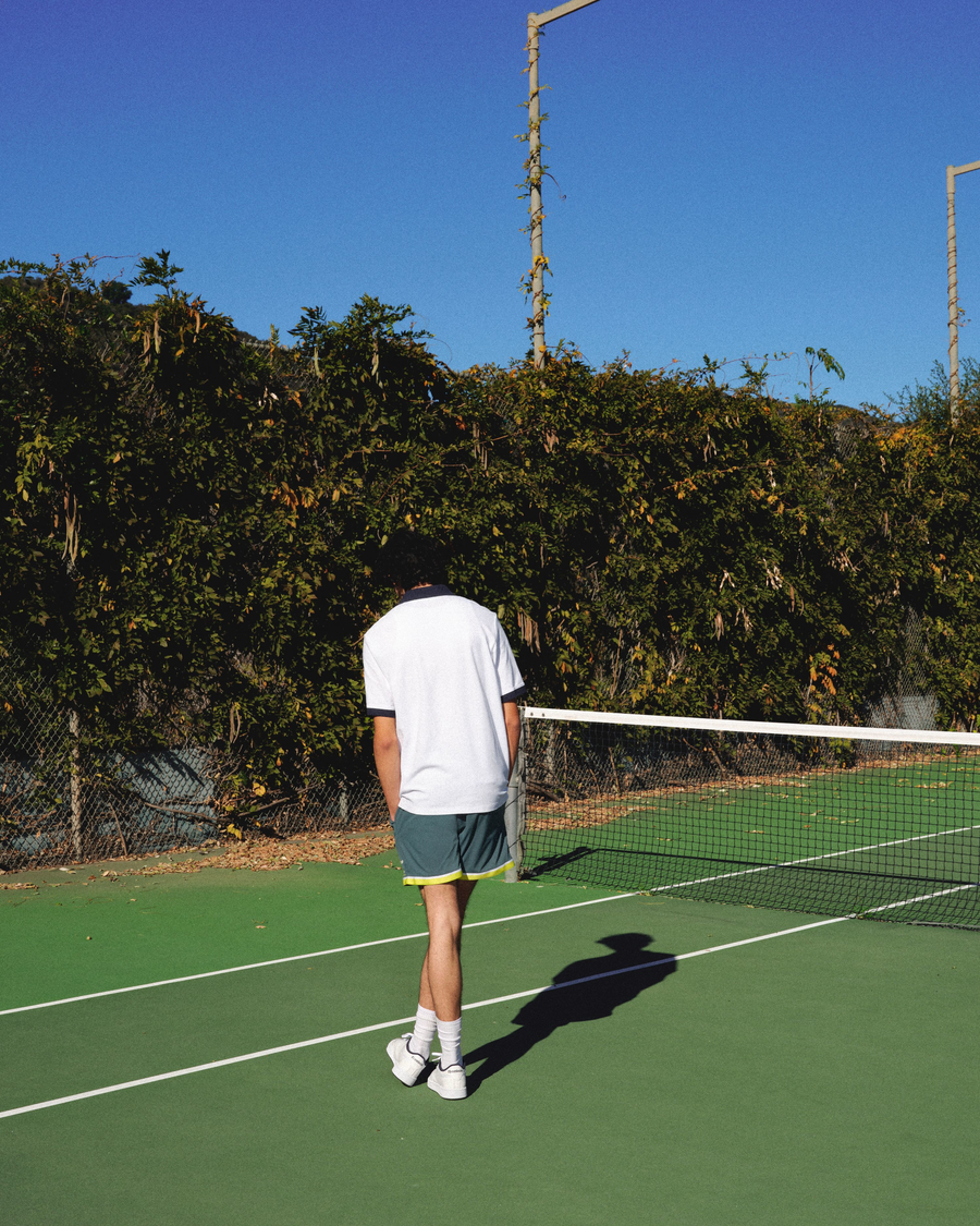 View of model wearing Navy Blazer Racquet Club Polo, Regular Fit.