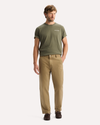 View of model wearing New British Khaki Original Chino Pants, Relaxed Taper Fit.