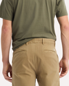 View of model wearing New British Khaki Original Chino Pants, Relaxed Taper Fit.