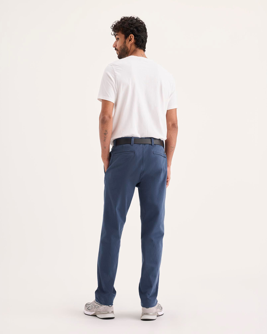 Back view of model wearing Ocean Blue Alpha Chino Pants, Slim Fit.