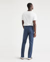 Back view of model wearing Ocean Blue Men's Slim Fit Original Chino Pants.