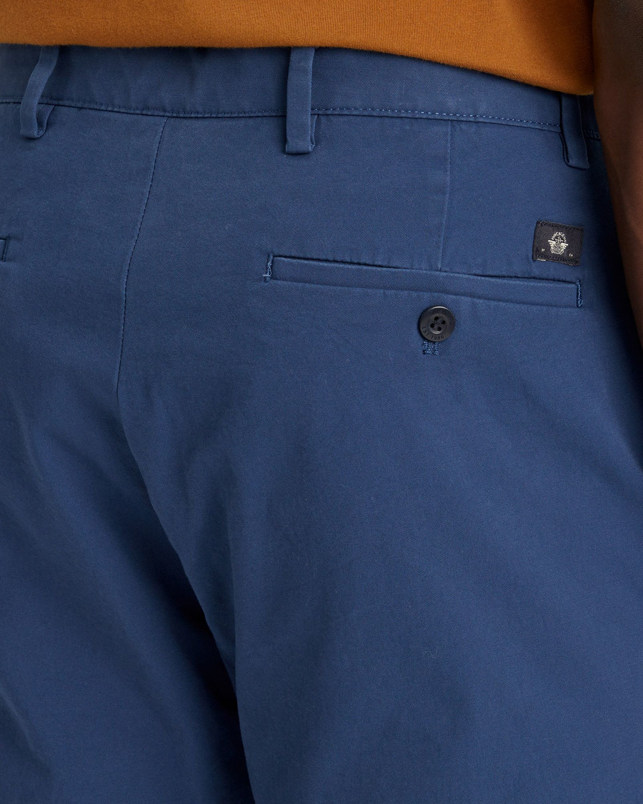 View of model wearing Ocean Blue Men's Slim Fit Smart 360 Flex Alpha Chino Pants.