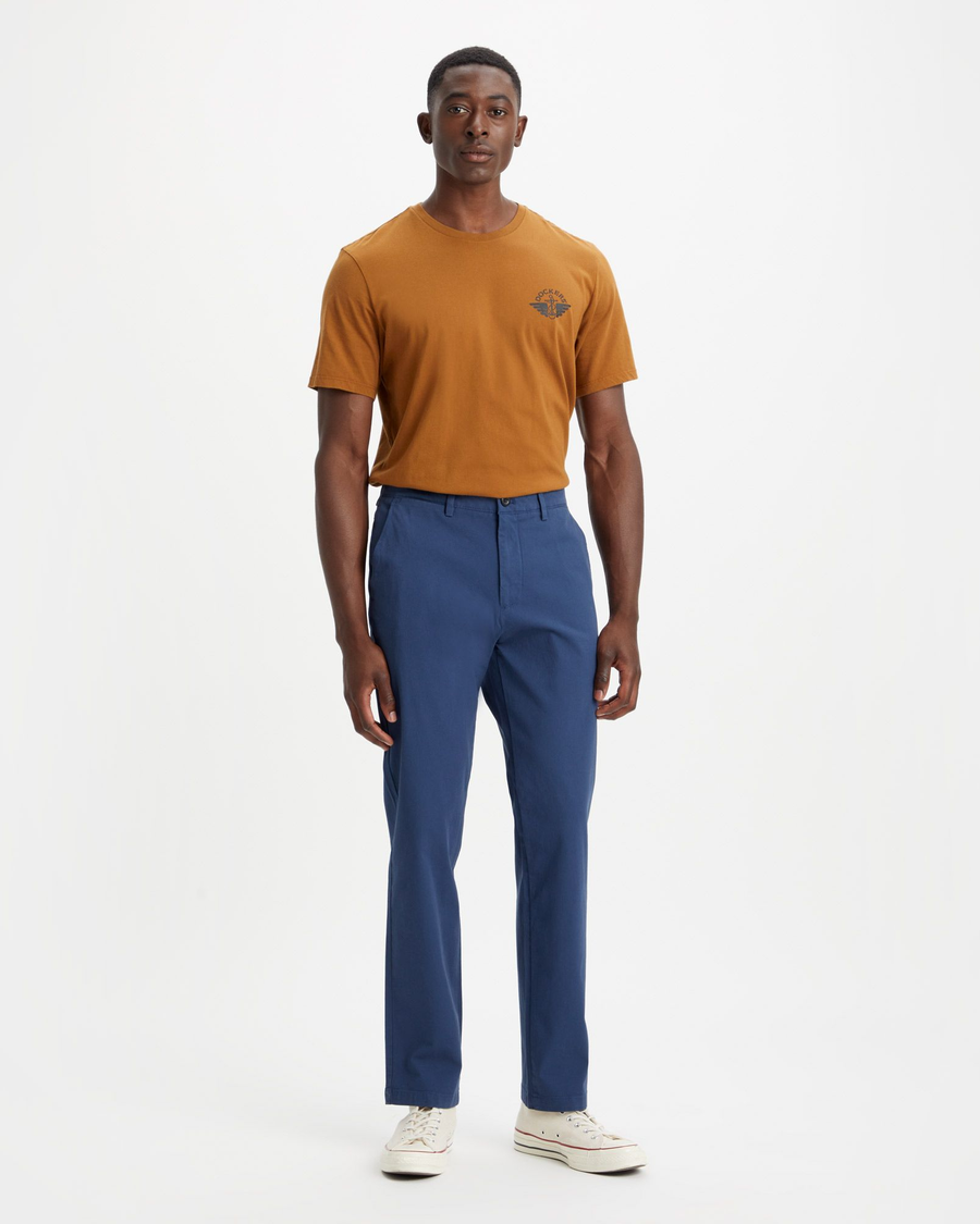 Front view of model wearing Ocean Blue Men's Slim Fit Smart 360 Flex Alpha Chino Pants.