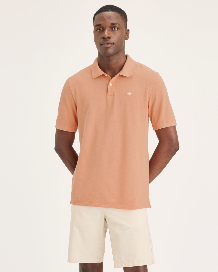 Front view of model wearing Peach Bloom Men's Slim Fit Pique Polo.