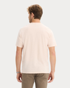 Back view of model wearing Peach Blush Graphic Tee, Regular Fit.