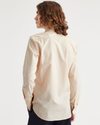 Back view of model wearing Playoff Appleblossom Men's Slim Fit 2 Button Collar Shirt.