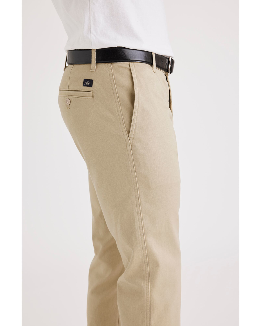 Side view of model wearing Safari Men's Slim Fit Original Chino Pants.