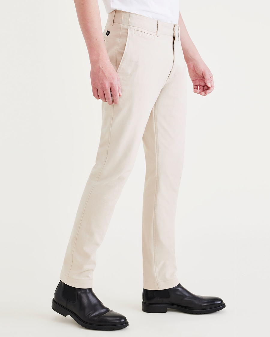 Side view of model wearing Sahara Khaki Men's Slim Fit Smart 360 Flex California Chino Pants.