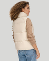 Back view of model wearing Sahara Khaki Women's Puffer Vest Jacket.