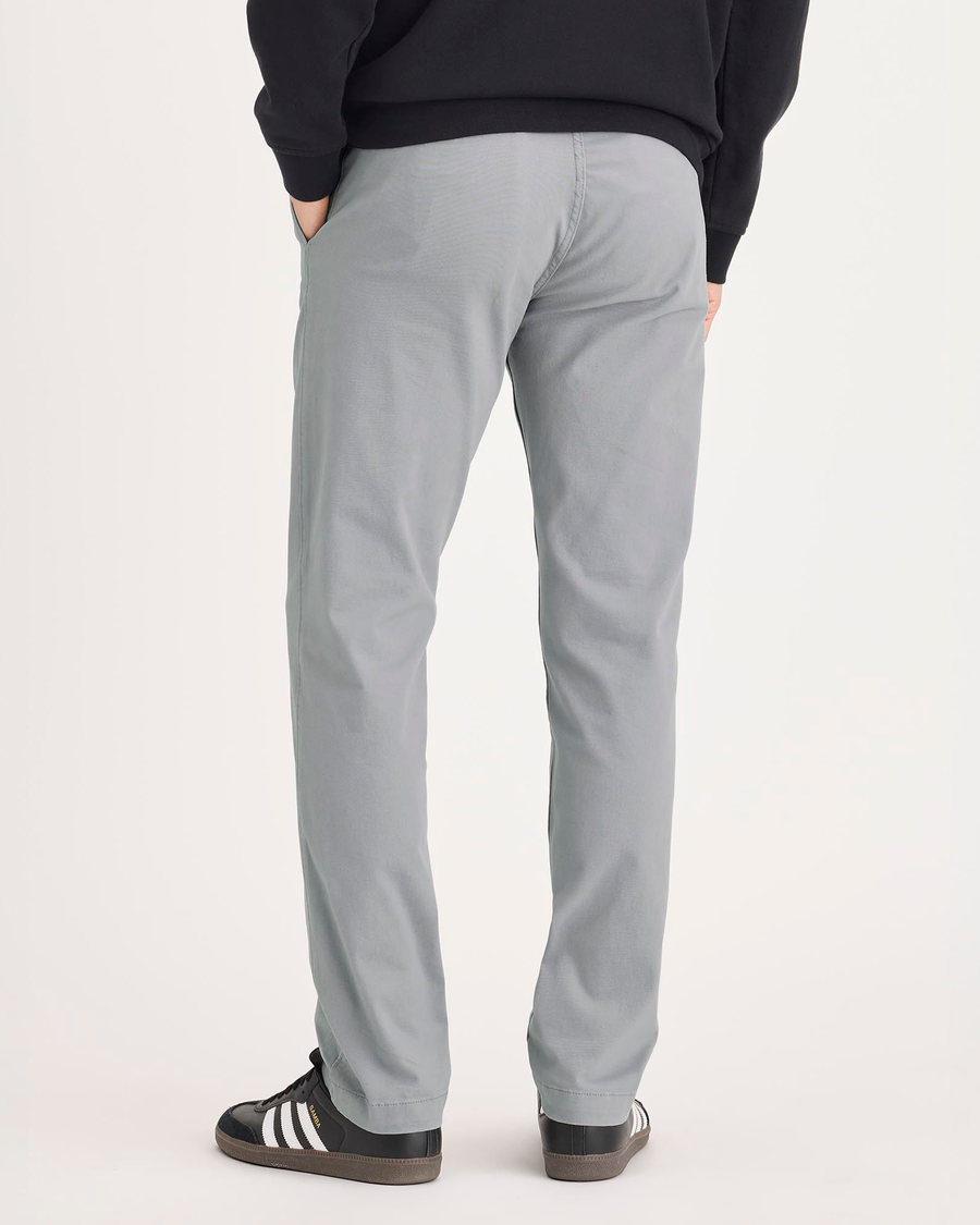 Back view of model wearing Sharkskin Alpha Chino Pants, Slim Fit.