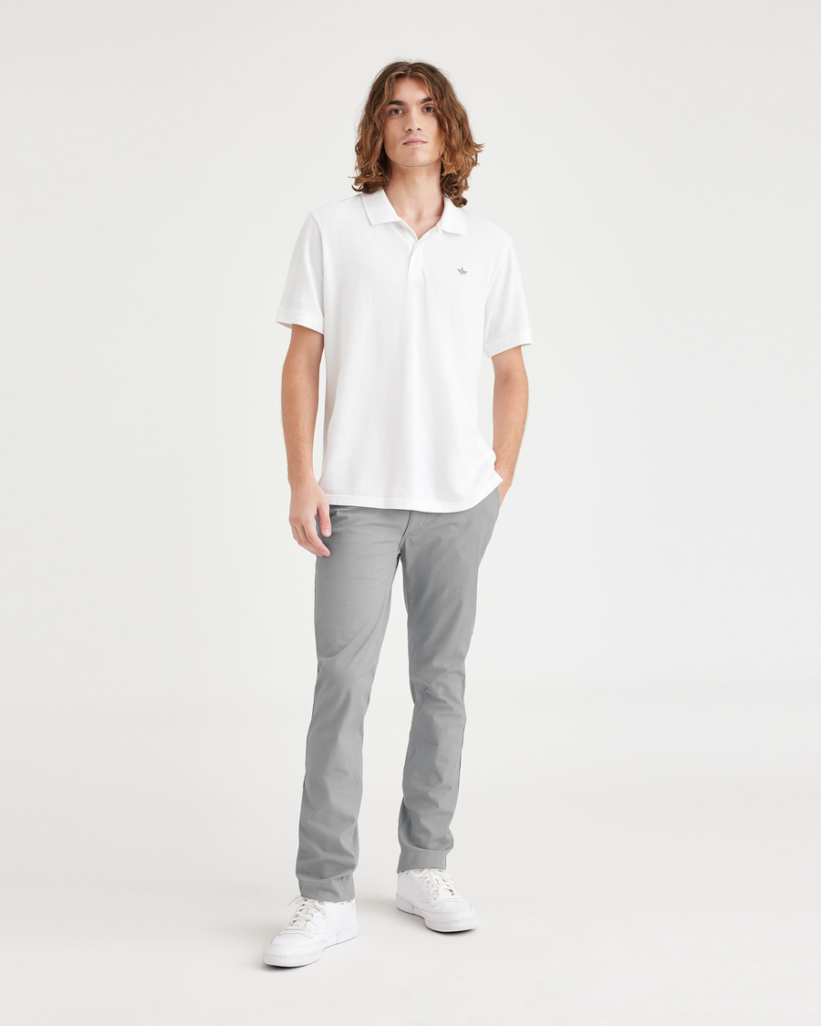 Front view of model wearing Sharkskin Men's Skinny Fit Smart 360 Flex California Chino Pants.