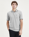 Front view of model wearing Smokestack Heather Men's Slim Fit Original Polo.