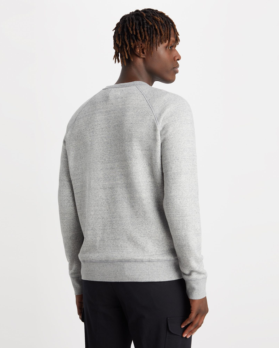 Back view of model wearing Smokestack Men's Regular Fit Icon Crewneck Sweatshirt.