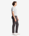 Side view of model wearing Steelhead Men's Slim Fit Smart 360 Flex Alpha Khaki Pants.