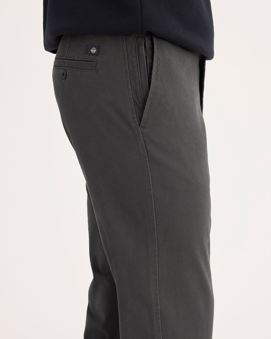 Side view of model wearing Steelhead Ultimate Chinos, Slim Fit.