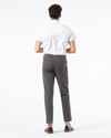 Back view of model wearing Storm Workday Khakis, Slim Fit.