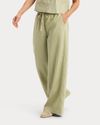 Side view of model wearing Tea Drawstring Pants.