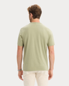 Back view of model wearing Tea Graphic Tee, Regular Fit.
