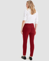 Back view of model wearing Tibetan Red Women's Skinny Fit Chino Pants.