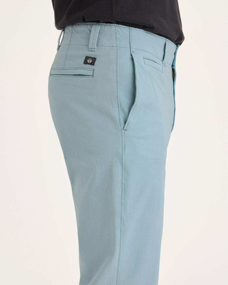 Side view of model wearing Tourmaline Men's Slim Fit Smart 360 Flex California Chino Pants.