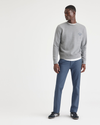 View of model wearing Vintage Indigo Men's Slim Fit Smart 360 Flex California Chino Pants.