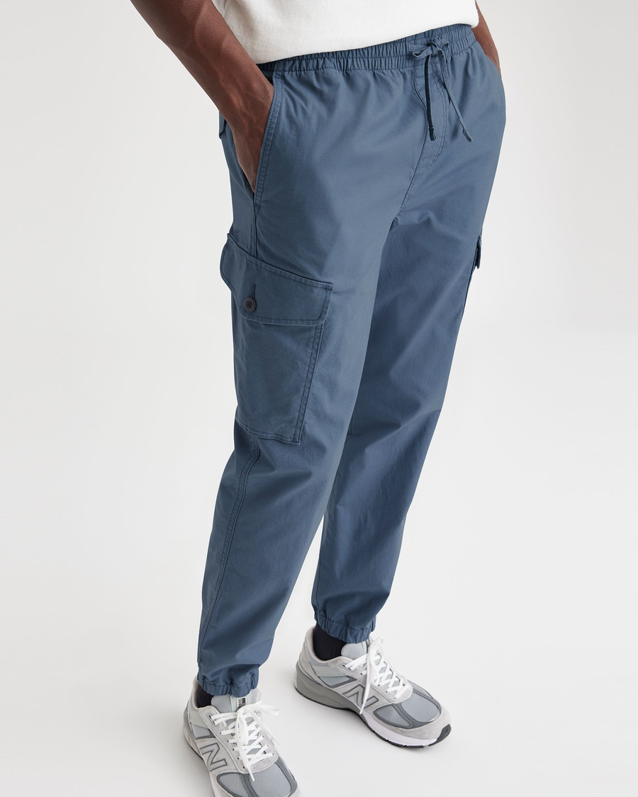 View of model wearing Vintage Indigo Men's Straight Tapered Fit Cargo Jogger Pants.