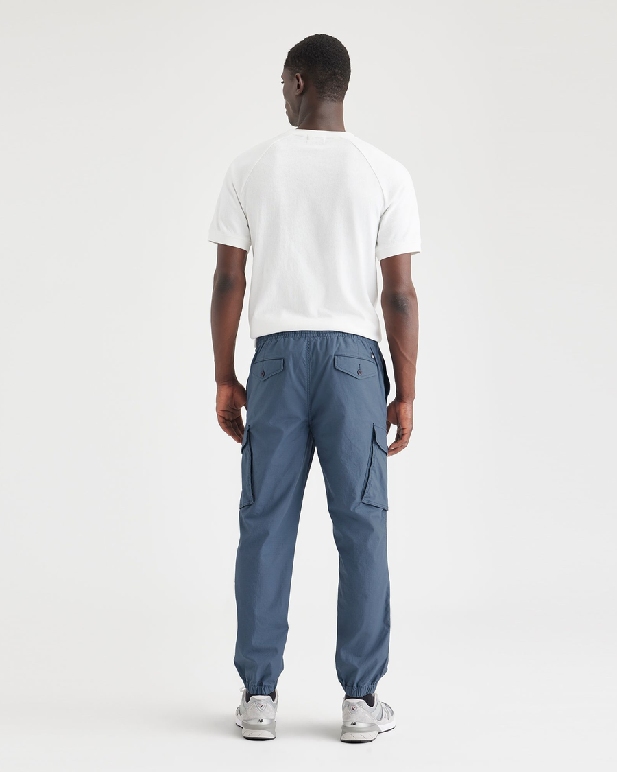 Back view of model wearing Vintage Indigo Men's Straight Tapered Fit Cargo Jogger Pants.